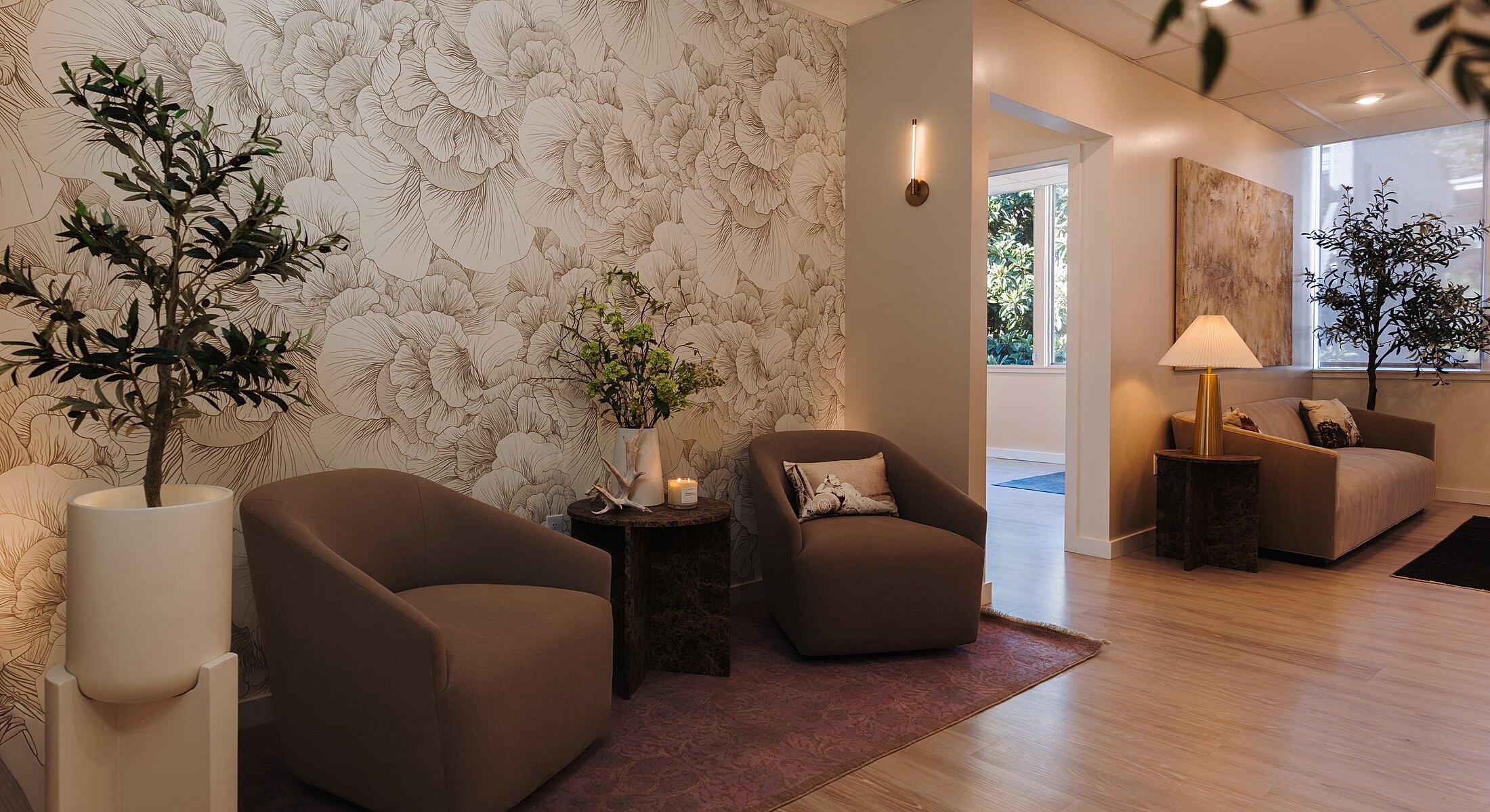 Contemporary waiting area with floral wallpaper decor.