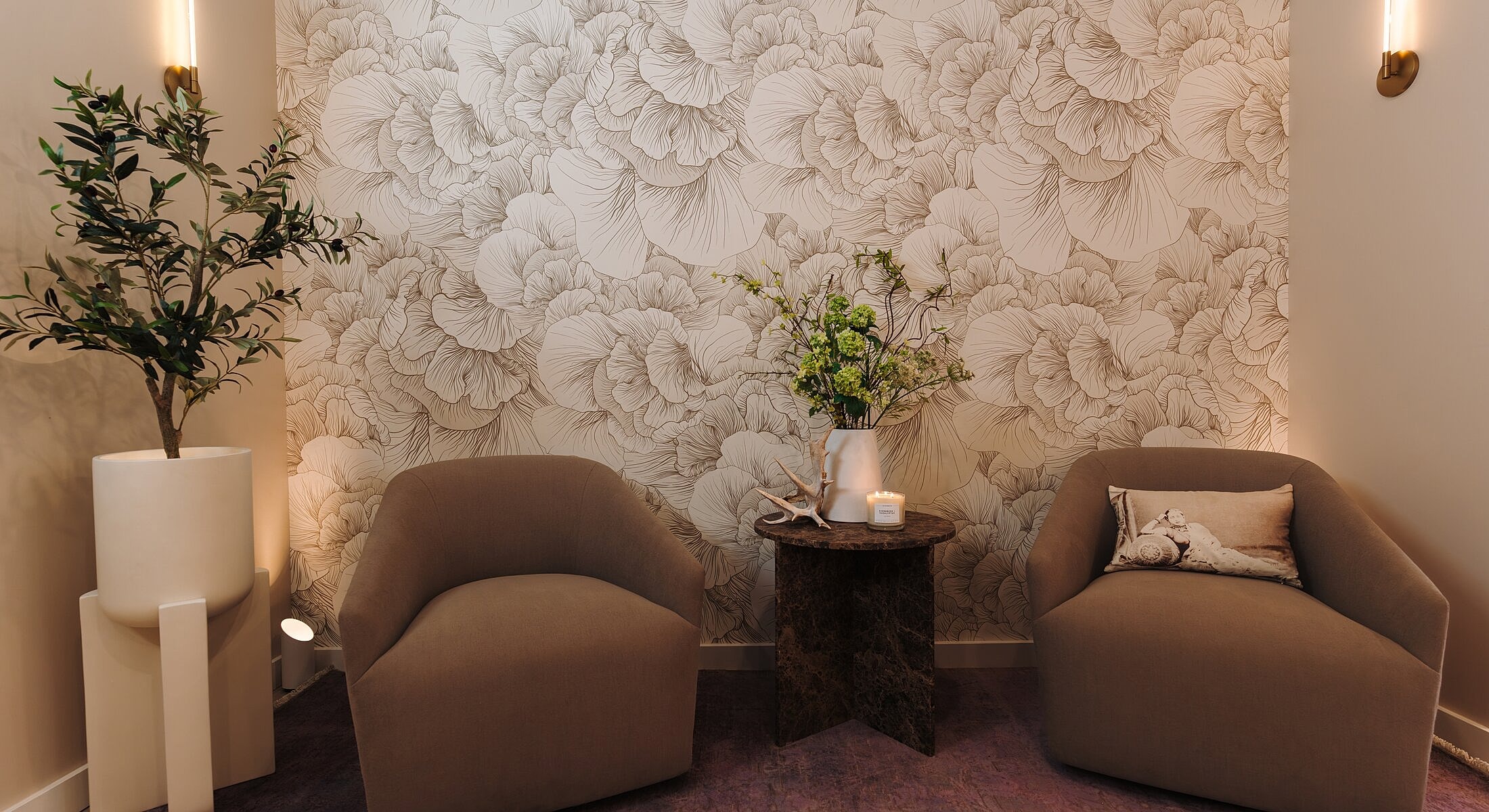 Cozy seating area with floral wallpaper decor.