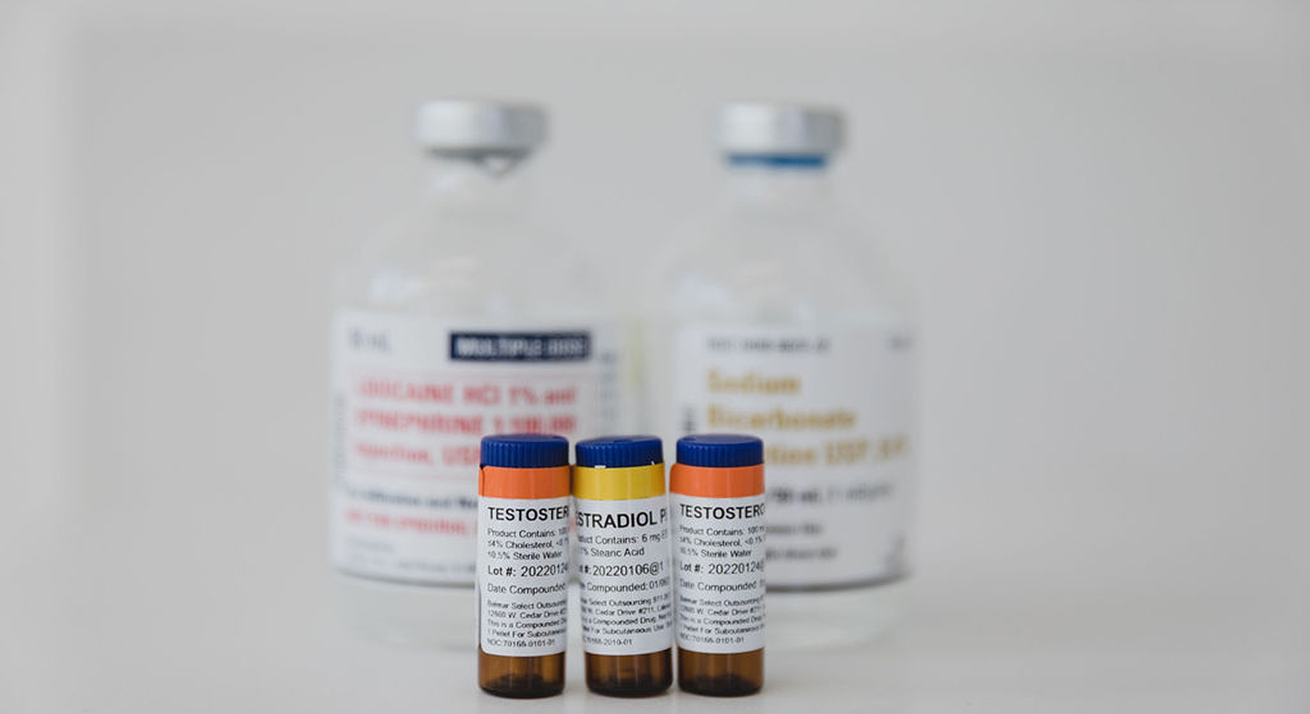 Vials and labels for hormone medication therapy.
