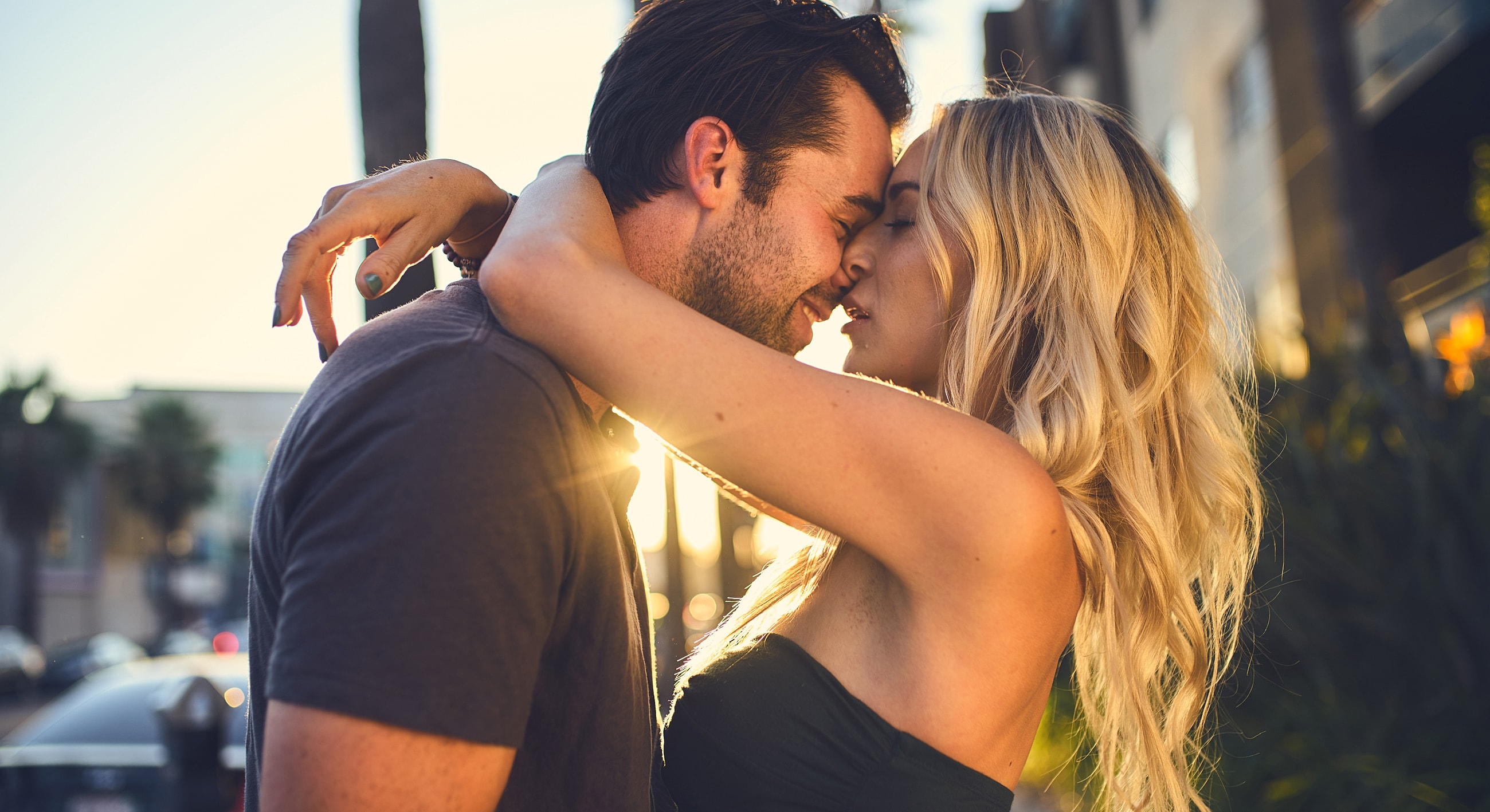 Couple sharing a romantic moment at sunset.