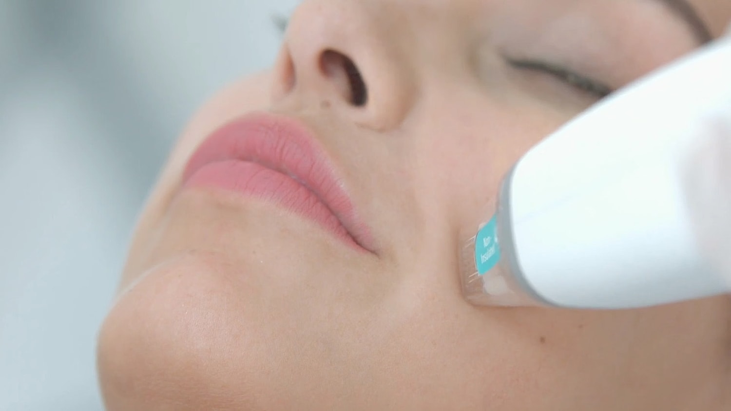 Facial treatment with a skincare device.